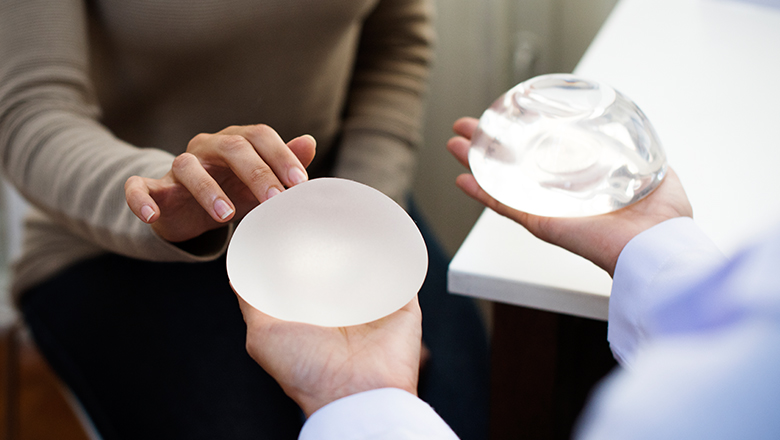 woman selecting breast implants