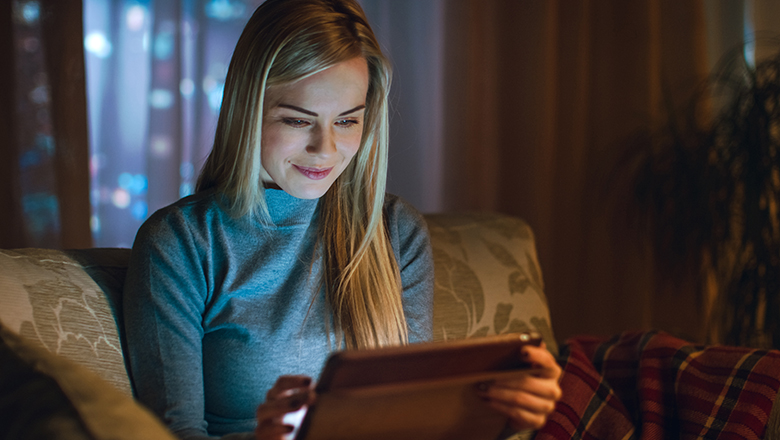 woman browsing social media on tablet