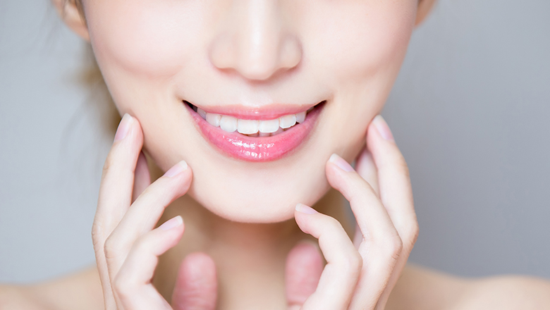 close up on a woman's cheeks and jawline